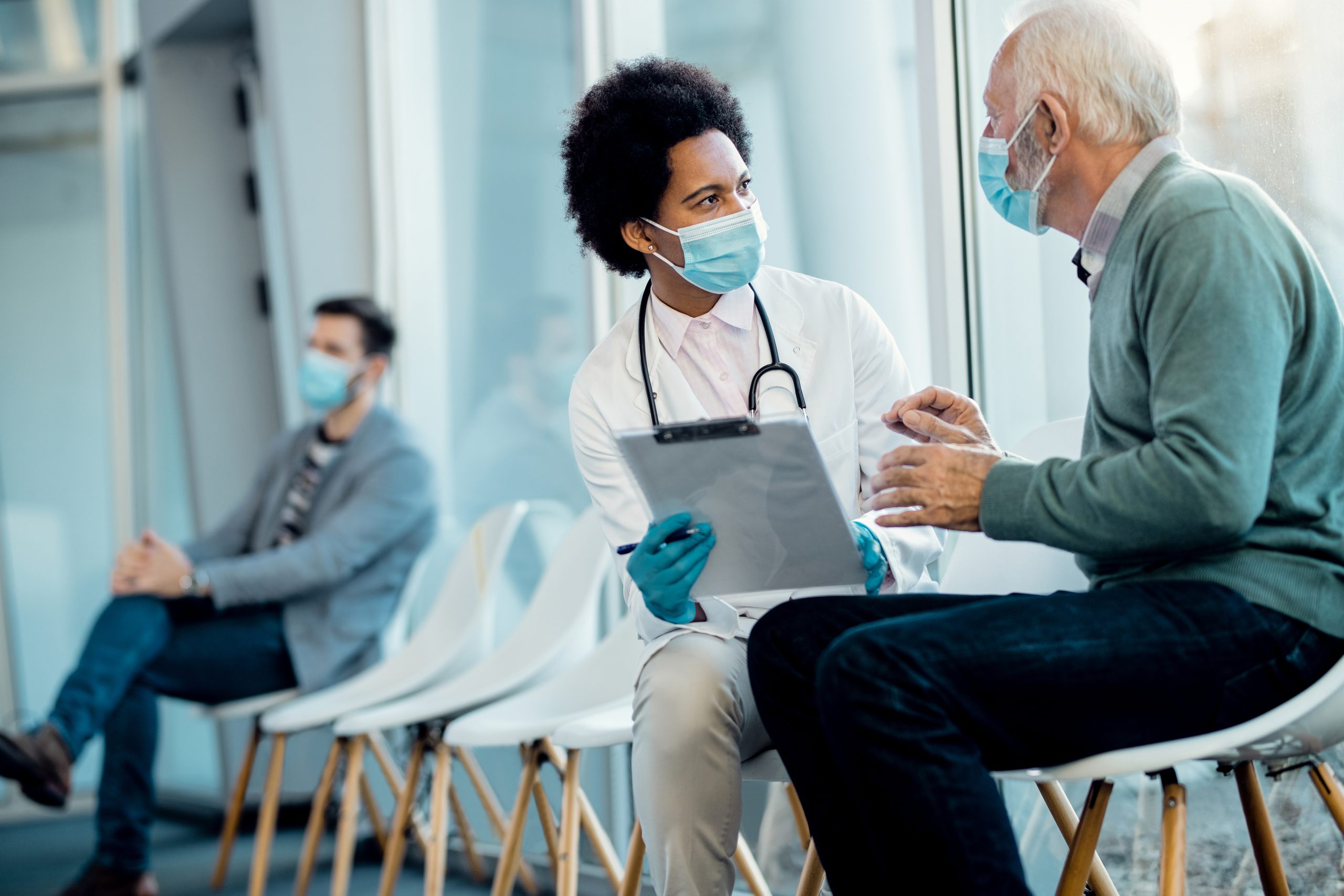 Doctor discussing a medical report with a patient